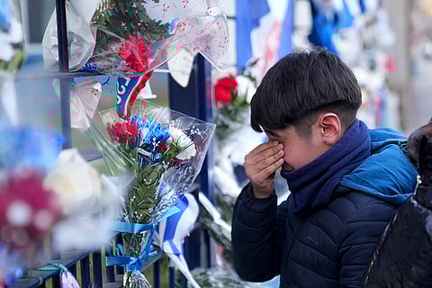 Juan Izquierdo: A child visits a makeshift memorial honoring soccer player Juan Izquierdo
